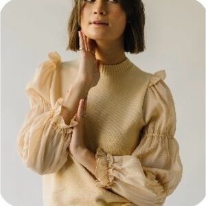 Elegant Cream Sweater with Sheer Ruffle Sleeves